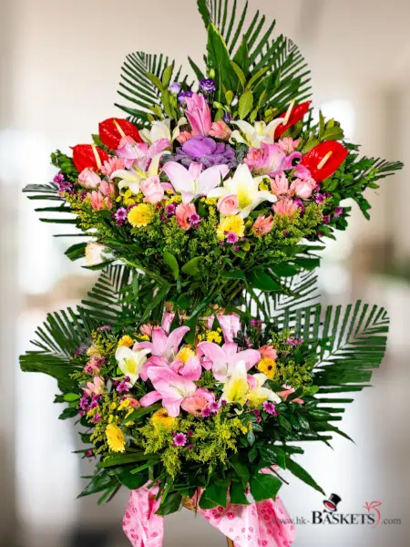 Flower arrangement  (Deluxe1 - The Pink Prosperity Basket overflows with the sweet charm of pink roses and alstroemerias, inviting luck and abundance at every turn.